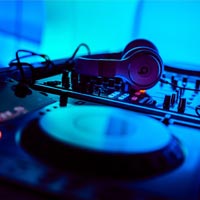 DJ turntables with audio and production equipment
